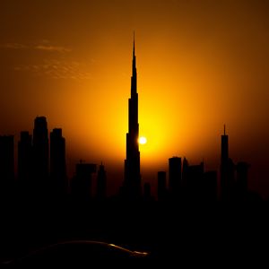 Preview wallpaper sunset, city, building, silhouette