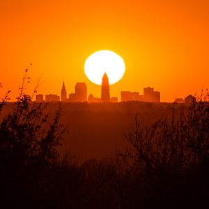 Preview wallpaper sunset, city, buildings, silhouette, sun, dusk