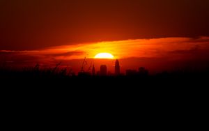 Preview wallpaper sunset, city, buildings, dark, dusk