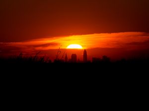 Preview wallpaper sunset, city, buildings, dark, dusk