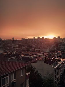 Preview wallpaper sunset, city, buildings, aerial view, dusk