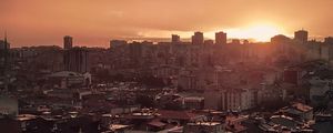 Preview wallpaper sunset, city, buildings, aerial view, dusk