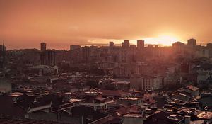 Preview wallpaper sunset, city, buildings, aerial view, dusk