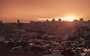 Preview wallpaper sunset, city, buildings, aerial view, dusk