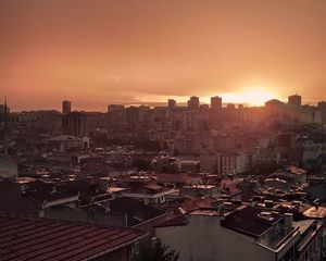 Preview wallpaper sunset, city, buildings, aerial view, dusk
