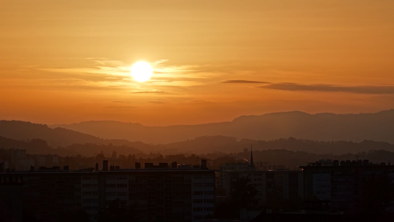 Wallpaper sunset, city, buildings, mountains, dusk