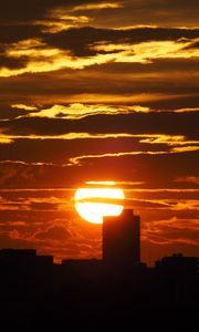 Preview wallpaper sunset, city, dark, buildings, silhouettes