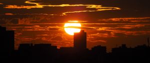 Preview wallpaper sunset, city, dark, buildings, silhouettes