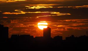 Preview wallpaper sunset, city, dark, buildings, silhouettes