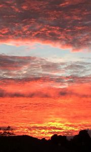 Preview wallpaper sunset, clouds, buildings, silhouette, sky