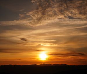 Preview wallpaper sunset, clouds, hills, sun, sky