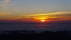 Preview wallpaper sunset, clouds, mountains, dusk