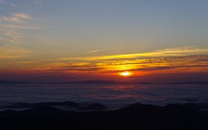 Preview wallpaper sunset, clouds, mountains, dusk