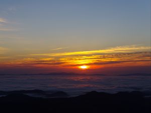 Preview wallpaper sunset, clouds, mountains, dusk