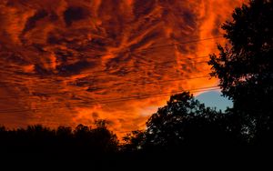 Preview wallpaper sunset, clouds, porous, dark