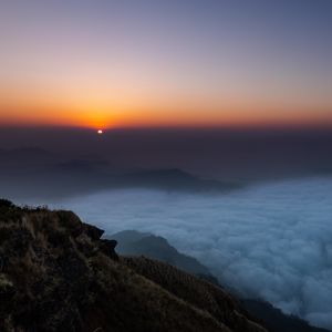 Preview wallpaper sunset, clouds, sky, fog, peak