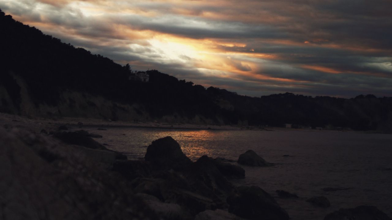 Wallpaper sunset, coast, stones, dark