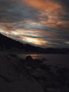 Preview wallpaper sunset, coast, stones, dark