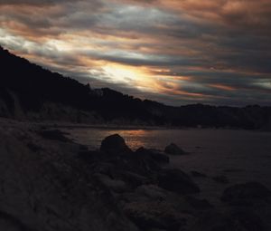 Preview wallpaper sunset, coast, stones, dark