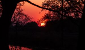 Preview wallpaper sunset, dusk, dark, outlines, trees, water, reflection