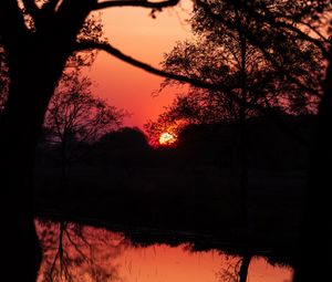 Preview wallpaper sunset, dusk, dark, outlines, trees, water, reflection