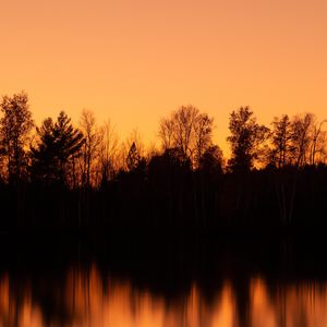 Preview wallpaper sunset, dusk, trees, water, reflection