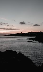 Preview wallpaper sunset, evening, sea, rocks, sky