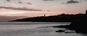 Preview wallpaper sunset, evening, sea, rocks, sky