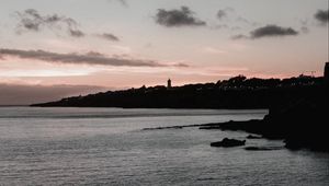 Preview wallpaper sunset, evening, sea, rocks, sky