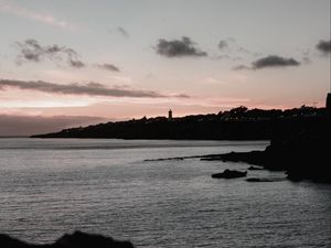 Preview wallpaper sunset, evening, sea, rocks, sky