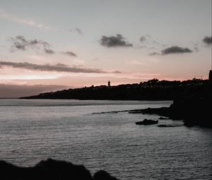 Preview wallpaper sunset, evening, sea, rocks, sky