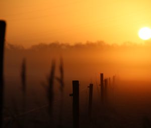 Preview wallpaper sunset, fence, fog, dusk