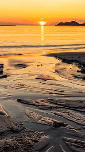 Preview wallpaper sunset, glare, sea, coast, sand