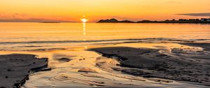 Preview wallpaper sunset, glare, sea, coast, sand