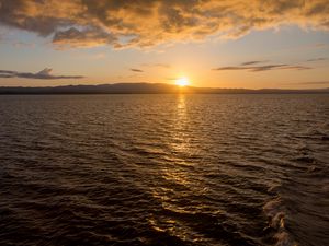 Preview wallpaper sunset, glare, sea, sun, sky