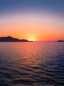 Preview wallpaper sunset, hills, sea, glare, sky