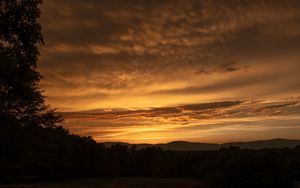 Preview wallpaper sunset, hills, trees, clouds, sky