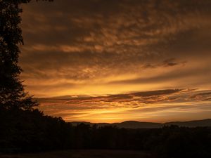 Preview wallpaper sunset, hills, trees, clouds, sky