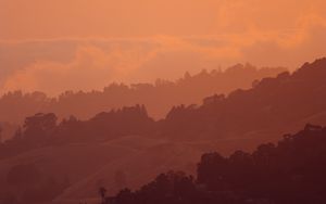 Preview wallpaper sunset, hills, trees, sky