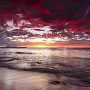 Preview wallpaper sunset, horizon, beach, stones, sea