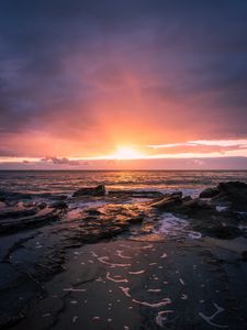 Preview wallpaper sunset, horizon, rock, sea, landscape