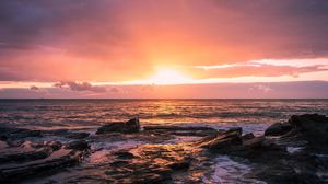 Preview wallpaper sunset, horizon, rock, sea, landscape