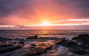 Preview wallpaper sunset, horizon, rock, sea, landscape