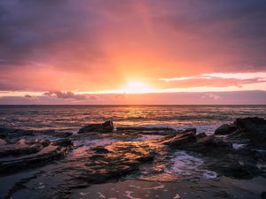 Preview wallpaper sunset, horizon, rock, sea, landscape
