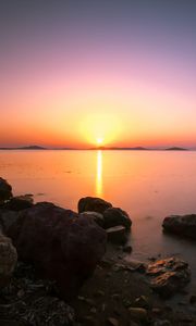 Preview wallpaper sunset, horizon, stones, sea