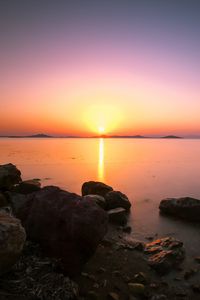 Preview wallpaper sunset, horizon, stones, sea