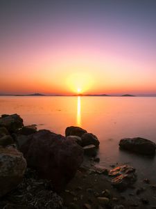 Preview wallpaper sunset, horizon, stones, sea