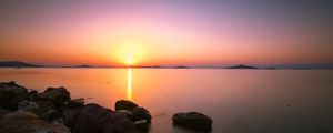 Preview wallpaper sunset, horizon, stones, sea