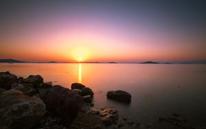 Preview wallpaper sunset, horizon, stones, sea