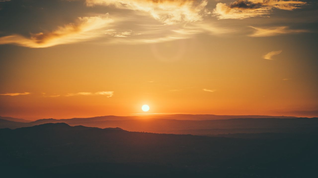 Wallpaper sunset, horizon, sun, hills, orange
